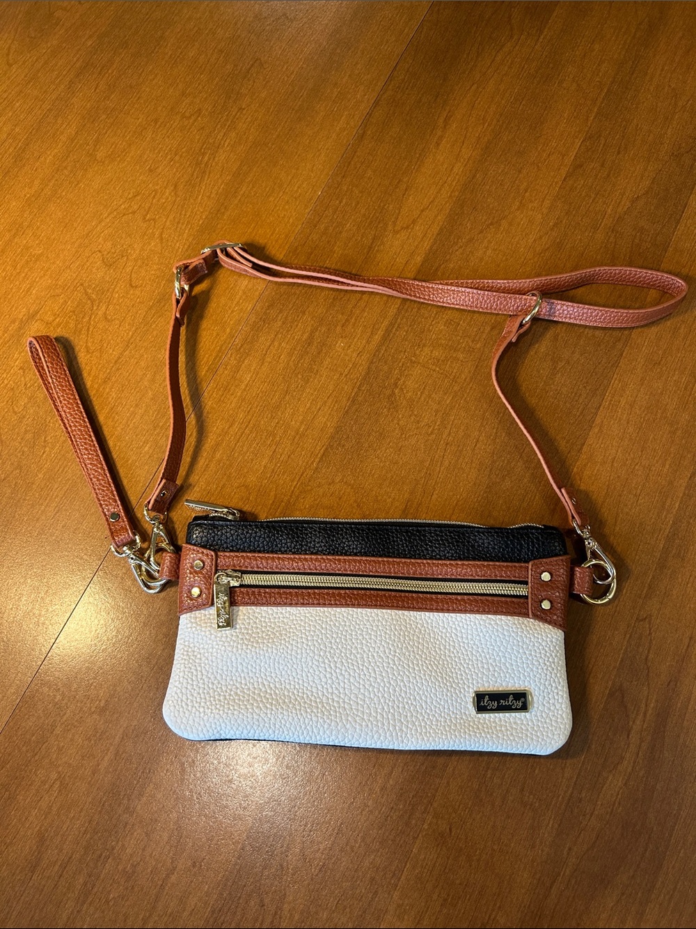 Itzy Ritzy Three-Tone Crossbody Wristlet Bag - White, Black & Brown